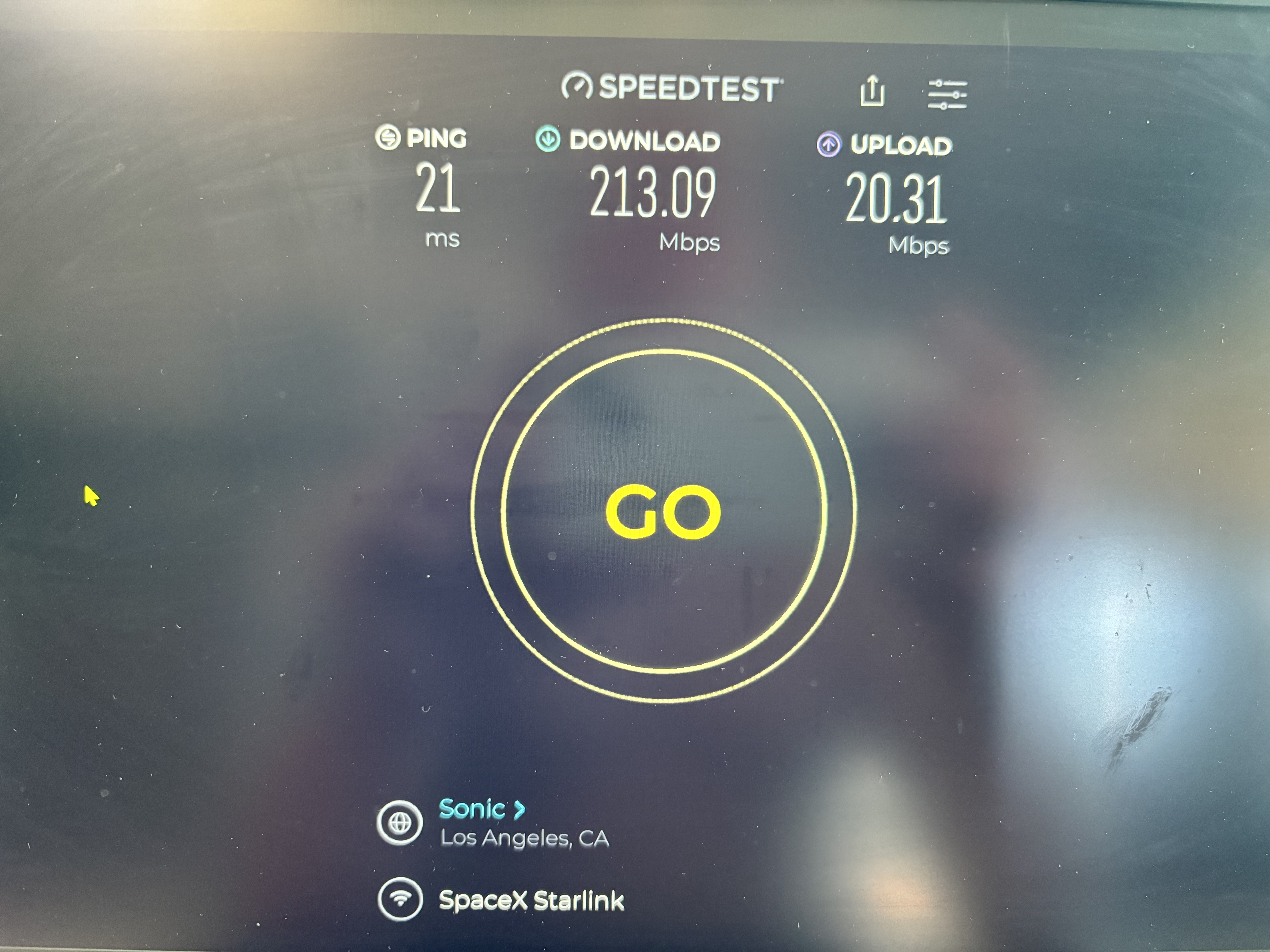 Ookla Speedtest on laptop showing 213.09 Mbps download, 20.31 Mbps upload, and 21 ms ping.